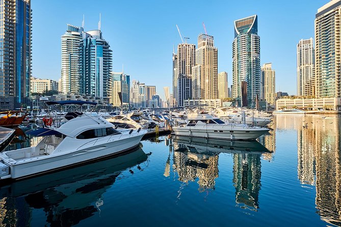 Half-Day Dubai City Tour With Blue Mosque, Creek, Souks & Abra - Architecture, Culture, and Growth
