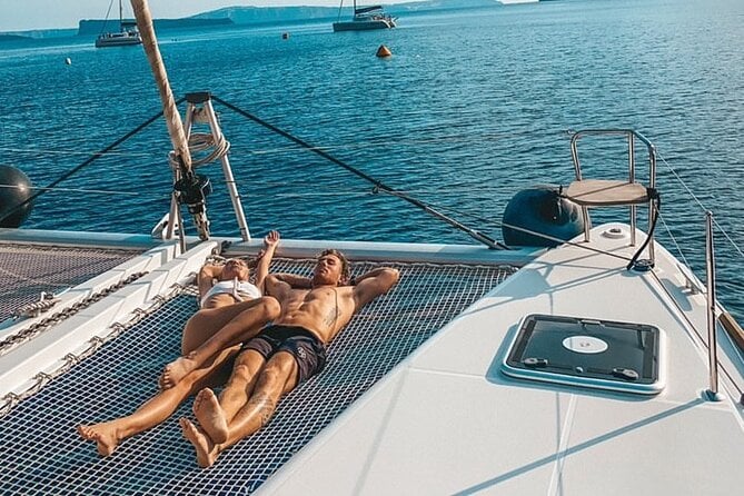 Half-Day Exclusive Catamaran Cruise in Santorini With Meal and Open Bar - On-Board Dining and Drinks