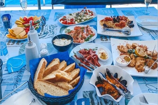 Half-Day Exclusive Catamaran Cruise in Santorini With Meal and Open Bar - Booking and Confirmation