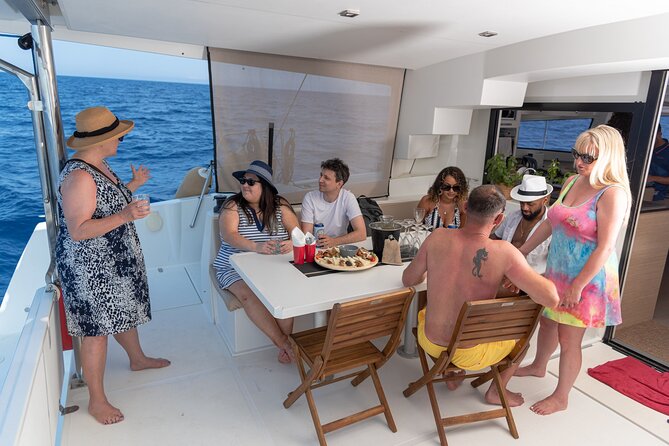 Hersonissos Sunset Catamaran Cruise With Finger Food & Drinks - Cancellation and Booking Details