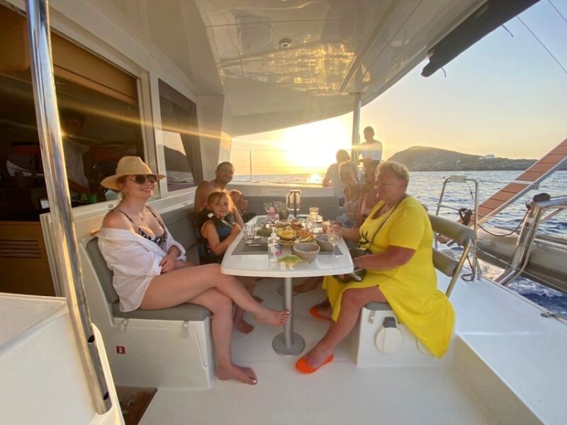 Hersonissos: Sunset Catamaran Trip With Finger Food & Drinks - Sailing and Onboard Activities