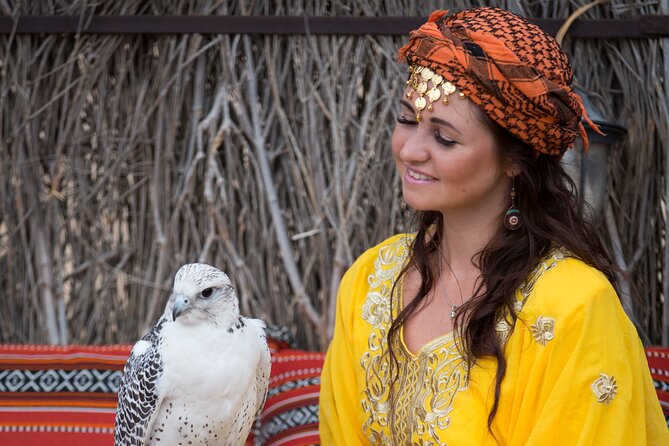 High Red Dunes With Camel Ride, Sandboarding, Falcon Show and VIP BBQ Dinner - Camel Ride and Falcon Experience