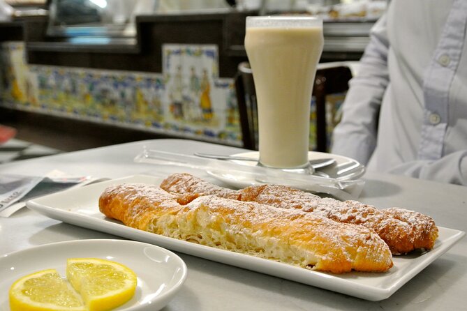 Highlights of Valencia Half-Day Private Tour With Local Tasting - Savoring Local Delicacies
