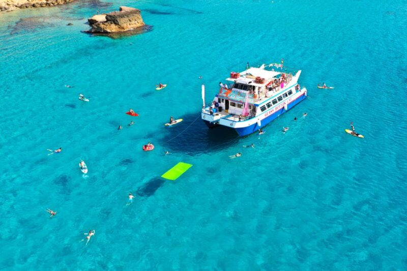 Ibiza: Beach Hopping Cruise W/ Paddleboard, Food, & Drinks - Docking and Beach Exploration