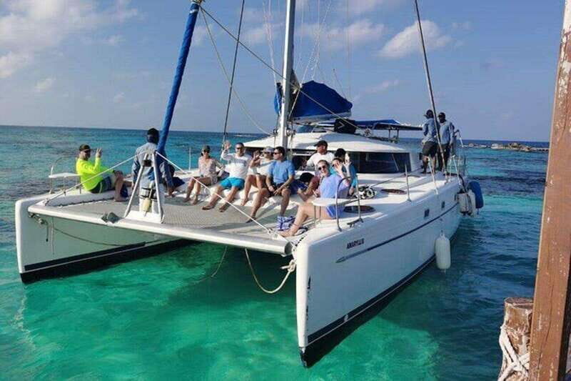 Isla Mujeres Plus Experience Catamaran Tour + Snorkel+Lunch - An Authentic Day on the Caribbean with a Balance of Adventure and Comfort