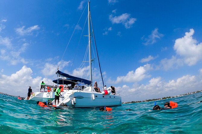 Isla Mujeres Tour on Catamaran With Snorkel, Open Bar, Buffet & Beach Club - Snorkeling and Aquatic Activities