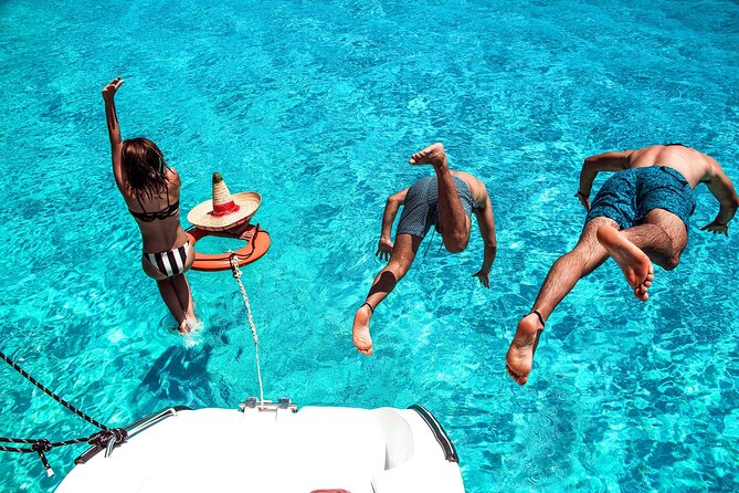 Isla Mujeres Tour on Catamaran With Snorkel, Open Bar, Buffet & Beach Club - Beach Club Access and Leisure