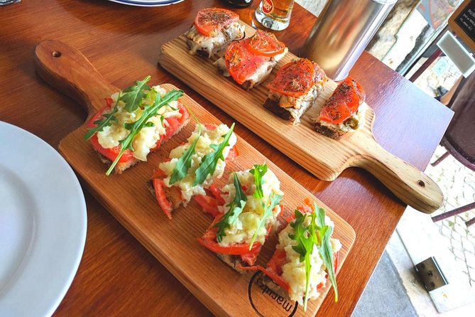 Lisbon Small-Group Food Tour With 18 Tastings in Alfama District - Meeting and End Points