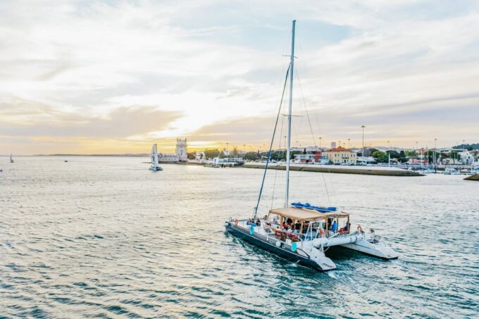 Lisbon: Sunset Catamaran Tour With Music and Drink - Key Sights Explored