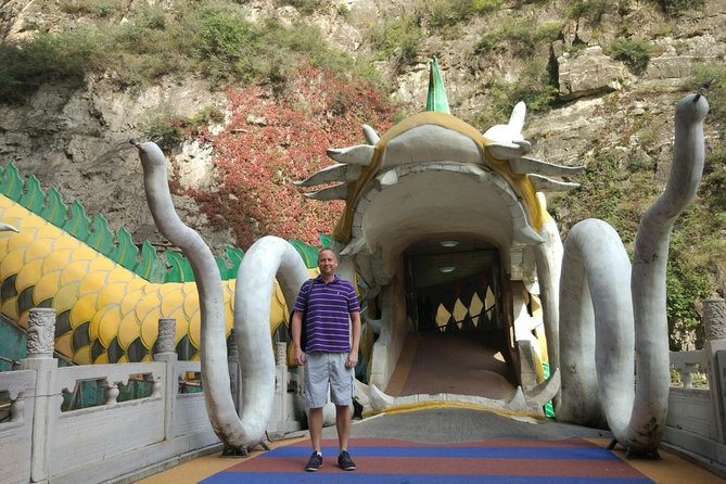 Longqingxia Gorge Cruise and Guyaju Cave Dwellings Private Day Tour - Escalator to the Caves