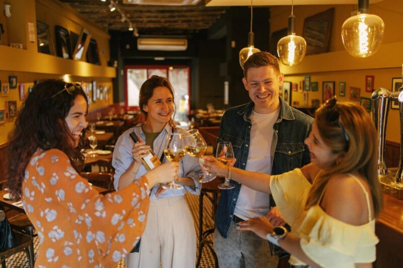 Madrid: Tapas Dinner Party Food Tour With Guide - Sampling Spanish Tapas and Drinks