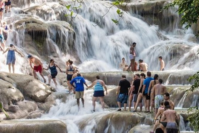 Martha Brae Rafting & Dunns River Falls From Montego Bay - Discovering Dunns River Falls