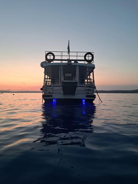 Mellieha: 2 Bay Evening Sunset Cruise Crystal & Blue Lagoon - Live Tour Guide and Refund Policy