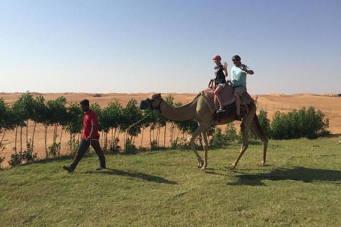 Morning Camel Trekking Over the Red Sand Dunes - Journey Through the Red Sand Dunes