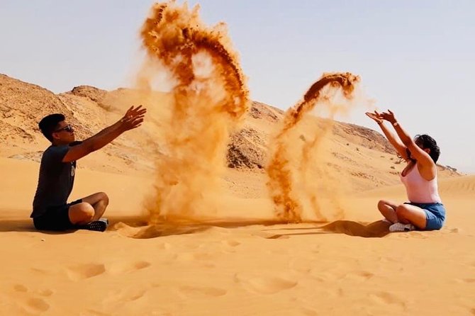 Morning Red Dunes With Camel Ride, Sandboarding and Refreshments - Gliding Down the Dunes