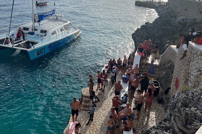 Negril 7 Mile Beach, Party Catamaran Cruise and Ricks Cafe Combo - Convenient Private Transportation