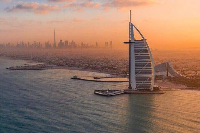 Old and Modern Dubai City Tour With Blue Mosque Visit - Riding the Abra Boat