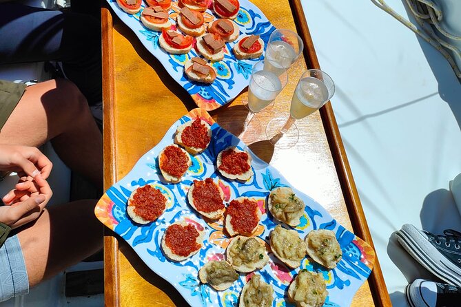 One Day Excursion on a Sailing Boat in the Gulf of Alghero - Enjoying the Culinary Offerings