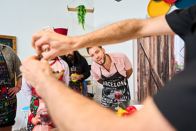 Paella Barcelona: Market Visit, Tapas, Sangria and Paella Class - Paella Cooking Class Highlights