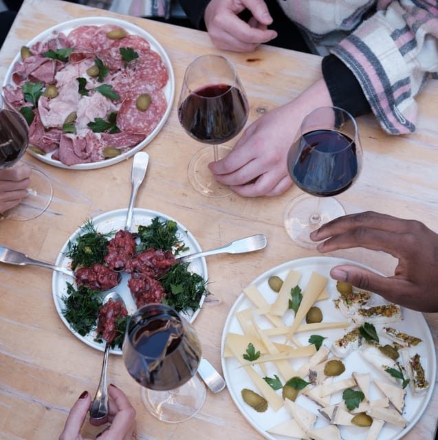 Paris: Gastronomy & Wine Tour by a Culinary School - Exploring the Iconic Parisian Neighborhoods