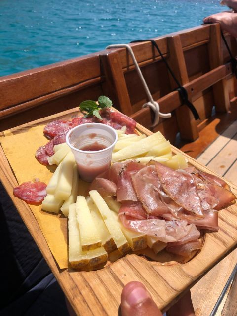 Porto San Paolo: Tavolara & Molara Vintage Cruise With Lunch - Savoring Sardinian Flavors During Onboard Lunch