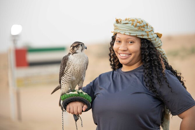 Premium Red Dunes Bashing With Quad Bike, Camel, Falcon &Vip Camp - Falcon Encounter