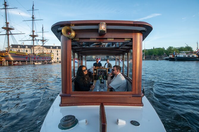 Private Boat Tour Amsterdam - 90 Min Incl. Welcome Drink on Historic Saloon Boat - Meeting and Pickup