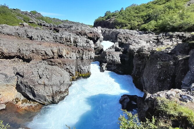 Private West Coast Waterfalls and Ice Cave Tour - Visiting the Ice Cave and Tunnel