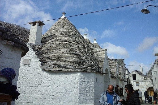 Puglia Full-Day Tour: Bari, Trulli of Alberobello, Castel Del Monte and Sassi of Matera - Admiring Castel Del Monte