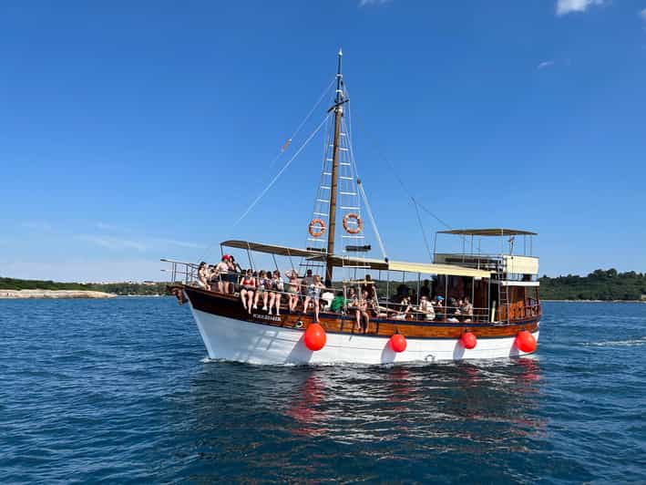 Pula: Dolphin Sunset Cruise on Traditional Wooden Boat - Dolphin Watching Experience