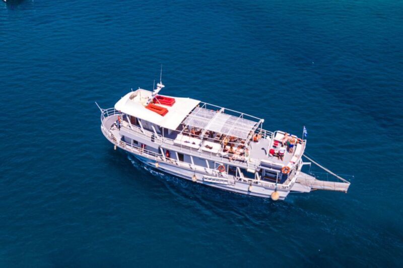 Rhodes: Bay to Bay Swim Cruise With Greek Buffet and Wine - Activities and Entertainment