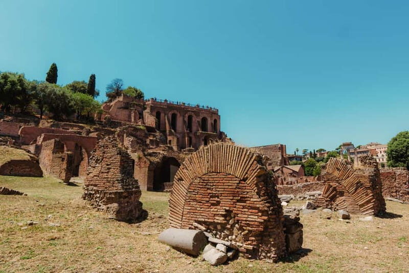 Rome: Colosseum & Roman Forum Experience With Audio Guide - Meeting Point and Arrival Information