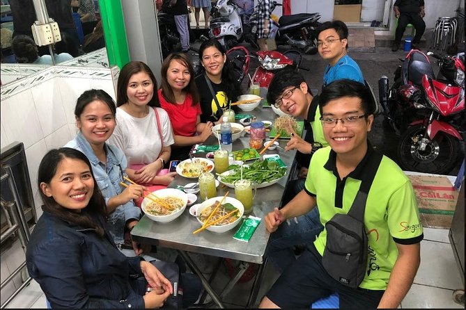 Saigon Night Sights & Local Food by Motorbike| Opt: Ao Dai Riders - District 4 and District 7 Rides