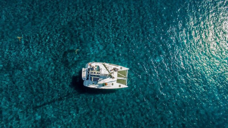 Santorini: 7-Hour Private Catamaran Cruise With Food & Drink - Departure and Itinerary