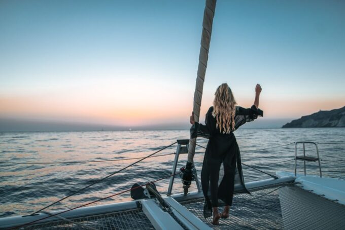 Santorini Catamaran Cruise With Swimming, Meal and Open Bar - Crew and Passenger Capacity