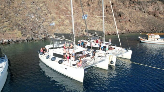 Santorini Catamaran Cruise With Swimming, Meal and Open Bar - Frequently Asked Questions