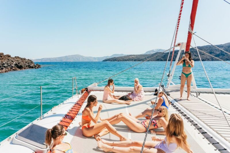 Santorini: Catamaran Tour With BBQ Dinner, Drinks, and Music - Itinerary Highlights