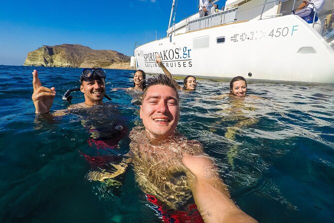 Santorini Classic Catamaran Cruise With Meal Drinks and Transfers - Safety and Accessibility