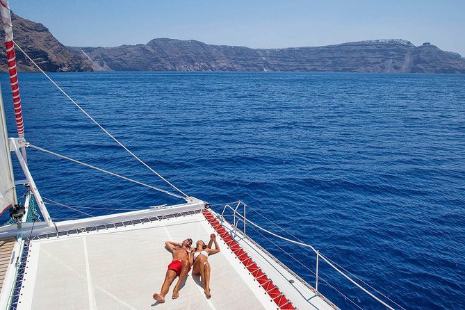 Santorini Cruise on Catamaran With BBQ & Open Bar - Cruise Inclusions and Transportation