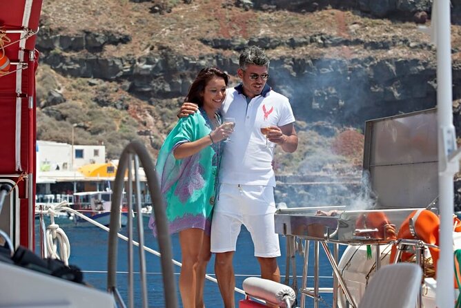 Santorini Cruise on Catamaran With BBQ & Open Bar - Explore Santorinis Coastline