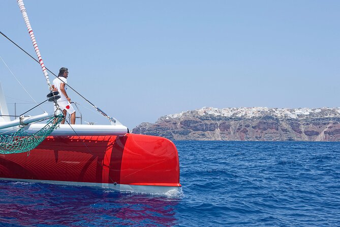 Santorini Cruise on Catamaran With BBQ & Open Bar - Onboard Activities and Amenities