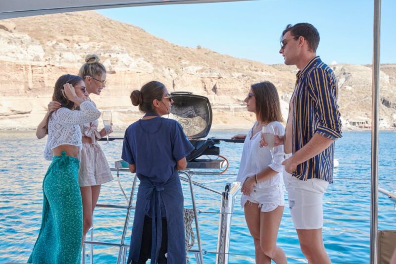 Santorini Gold Catamaran Cruise With Snorkel, BBQ & Open Bar - Snorkeling in Crystal-Clear Waters