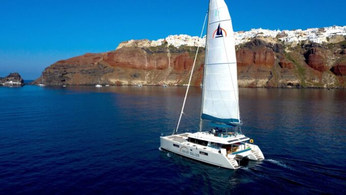 Santorini: Luxurious Catamaran Cruise With Meal & Open Bar - Exploring the Scenic Coastline