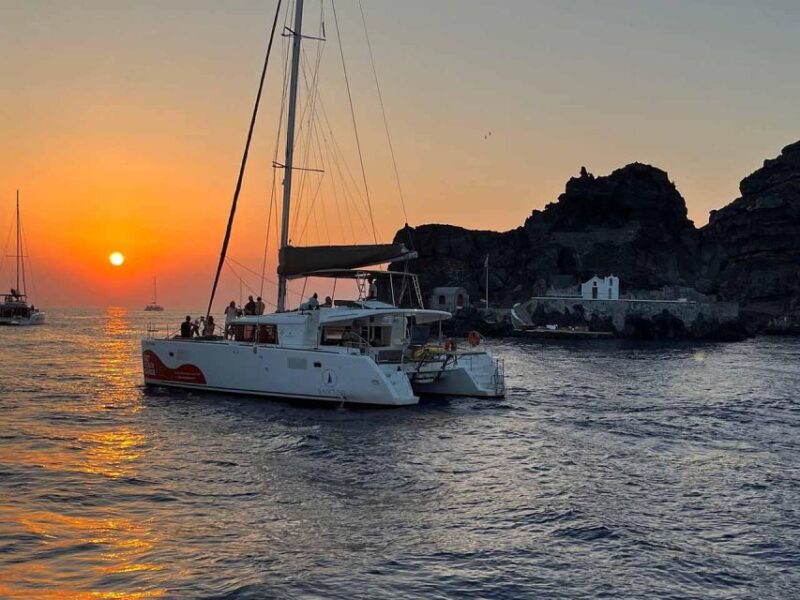 Santorini: Luxury Caldera Cruise With Full Greek Meal - Discovering the Renowned Red Beach