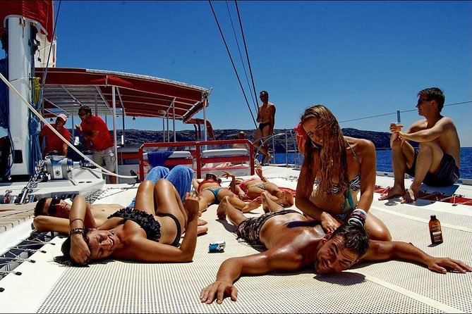Santorini Luxury Cruise With Full Greek Meal and 2 Swim Stops - Complimentary Drinks and Greek Meal