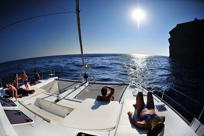Santorini Luxury Cruise With Full Greek Meal and 2 Swim Stops - Witness the Iconic Santorini Sunset