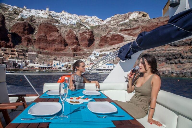 Santorini: Motor Yacht Sunset Cruise With 5-Course Dinner - Transportation and Hotel Pickup