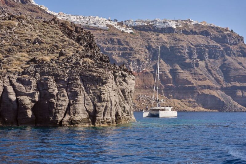 Santorini Oia: Caldera Catamaran Cruise With Meal & Drinks - Restrictions and Considerations