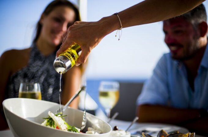 Santorini: Private Catamaran Cruise With BBQ Meal and Drinks - Pass by Fira Old Port