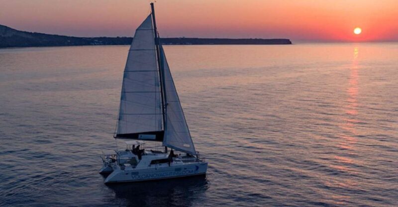 Santorini: Private Sunset Cruise With Dinner and Drinks - Coastline Exploration